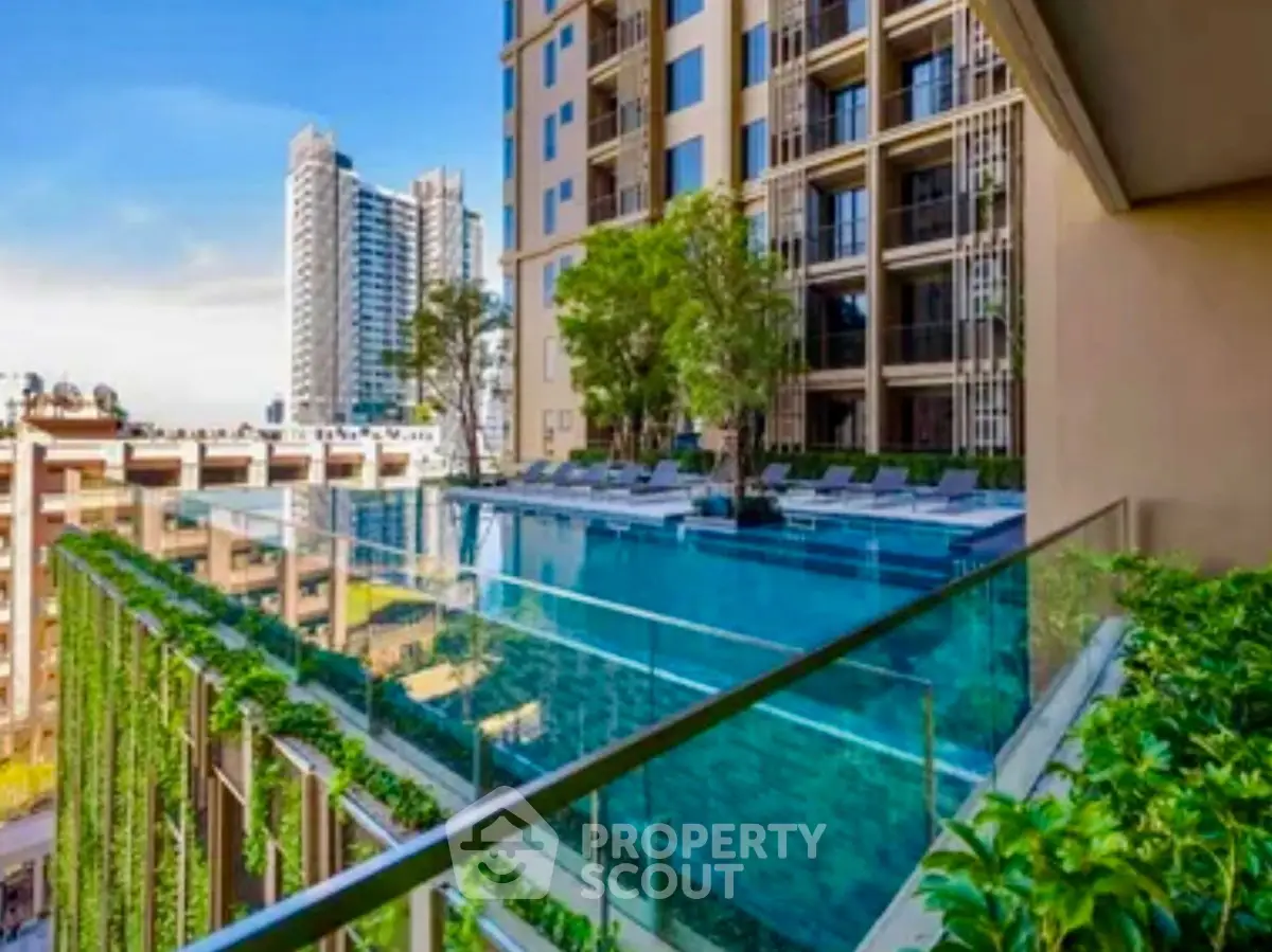 Luxurious high-rise building with stunning rooftop pool and city view