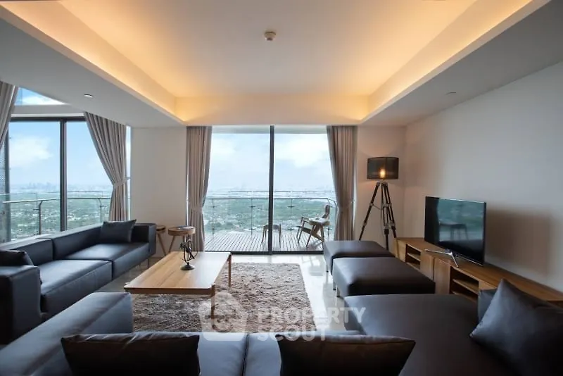Luxurious modern living room with panoramic city view and elegant furnishings