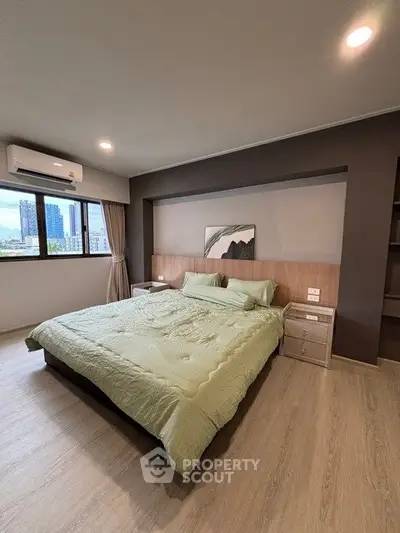 Spacious modern bedroom with city view and stylish decor
