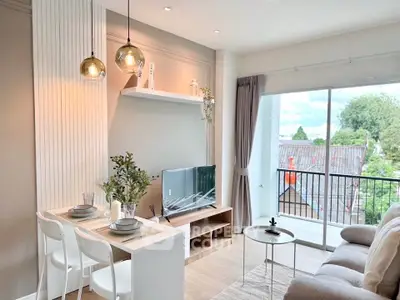 Modern living room with stylish decor and balcony view