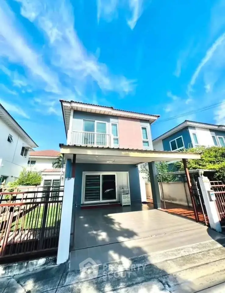 Charming two-story house with spacious driveway and modern design in a serene neighborhood.