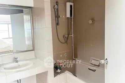Modern bathroom with bathtub and shower in a stylish apartment