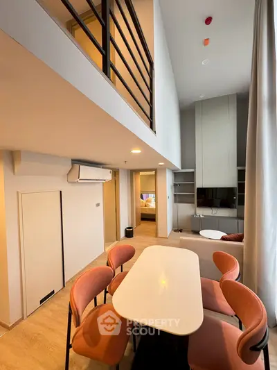 Modern loft apartment with stylish dining area and spacious living room