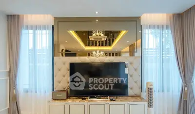 Luxurious living room with elegant decor and modern entertainment setup
