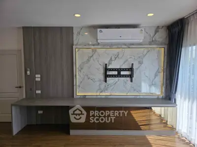 Modern living room with marble accent wall and air conditioning unit