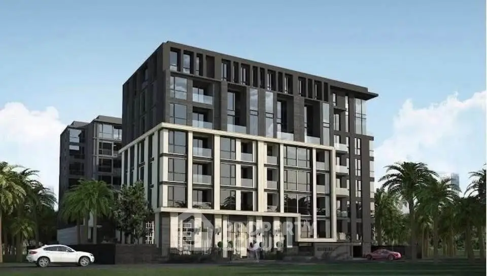Modern apartment building with sleek design and large windows, surrounded by palm trees.
