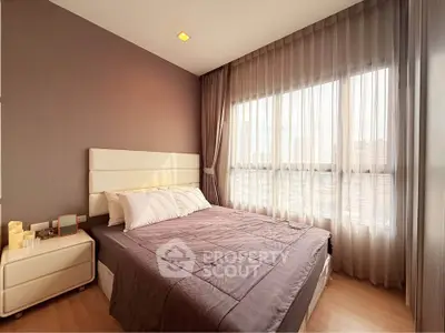 Modern bedroom with large window and elegant decor in urban apartment