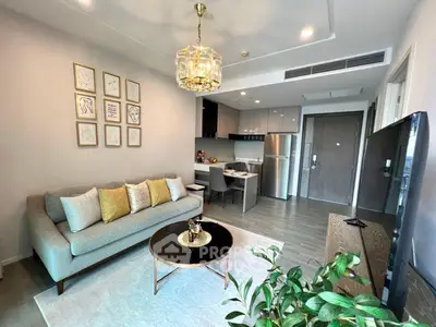 Modern living room with elegant decor and open kitchen layout