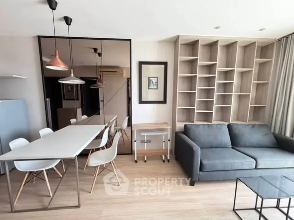 Modern living room with sleek furniture and built-in shelving, perfect for stylish urban living.