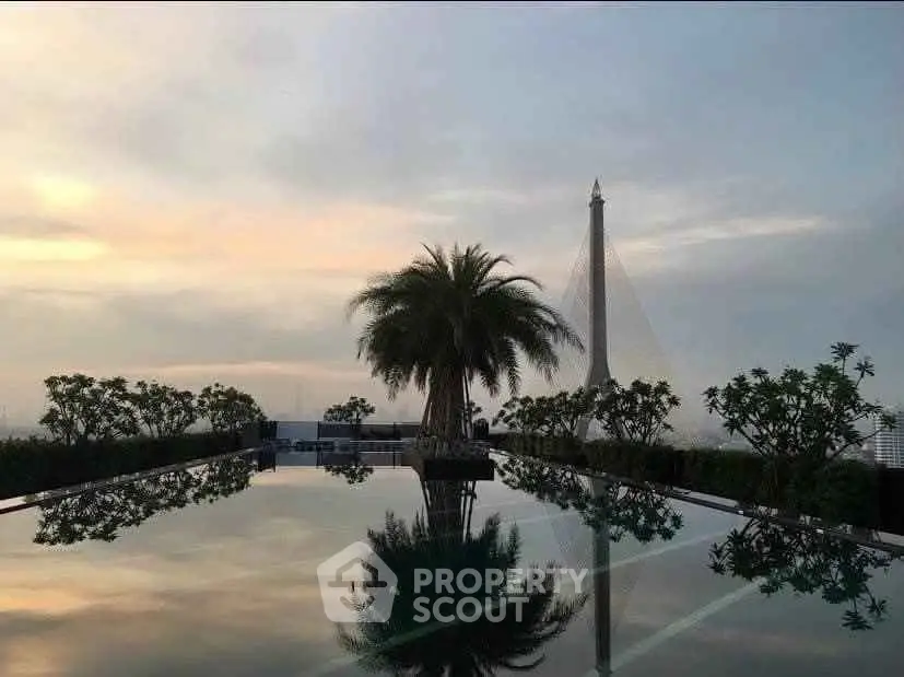 Stunning rooftop pool with panoramic city views and lush greenery, perfect for luxury living.