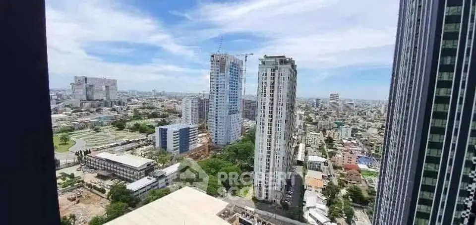 Stunning cityscape view from high-rise building showcasing urban skyline and architecture.