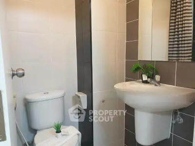 Modern bathroom with sleek fixtures and stylish tile design