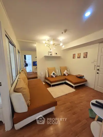 Cozy living room with modern brown sofas and stylish lighting