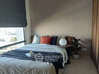 Modern bedroom with large window and stylish decor in urban apartment