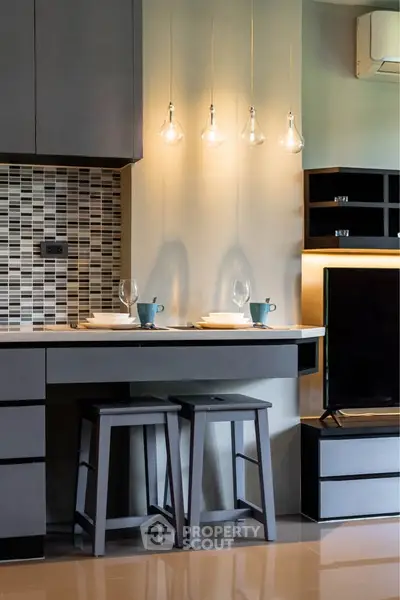 Modern kitchen with stylish lighting and sleek cabinetry