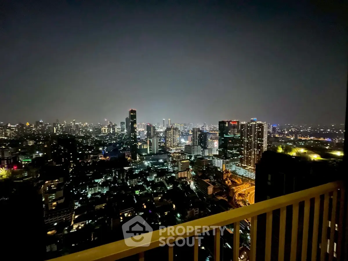 Stunning city skyline view from high-rise balcony at night