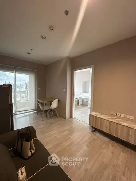 Modern apartment interior with open living space and balcony view