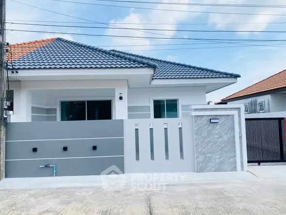 Modern single-story house with stylish facade and tiled roof