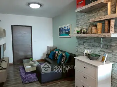 Chic living room with modern decor, cozy sofa, and stylish shelving in a contemporary apartment.