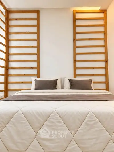 Modern bedroom with stylish wooden accents and cozy bedding