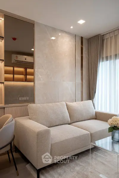 Modern living room with elegant beige sofa and stylish decor