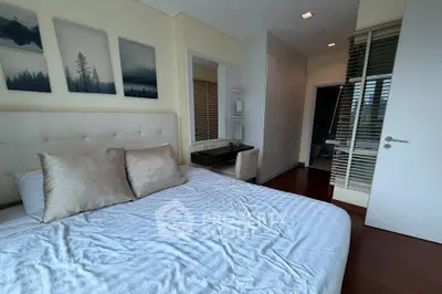 Spacious bedroom with elegant decor and natural light