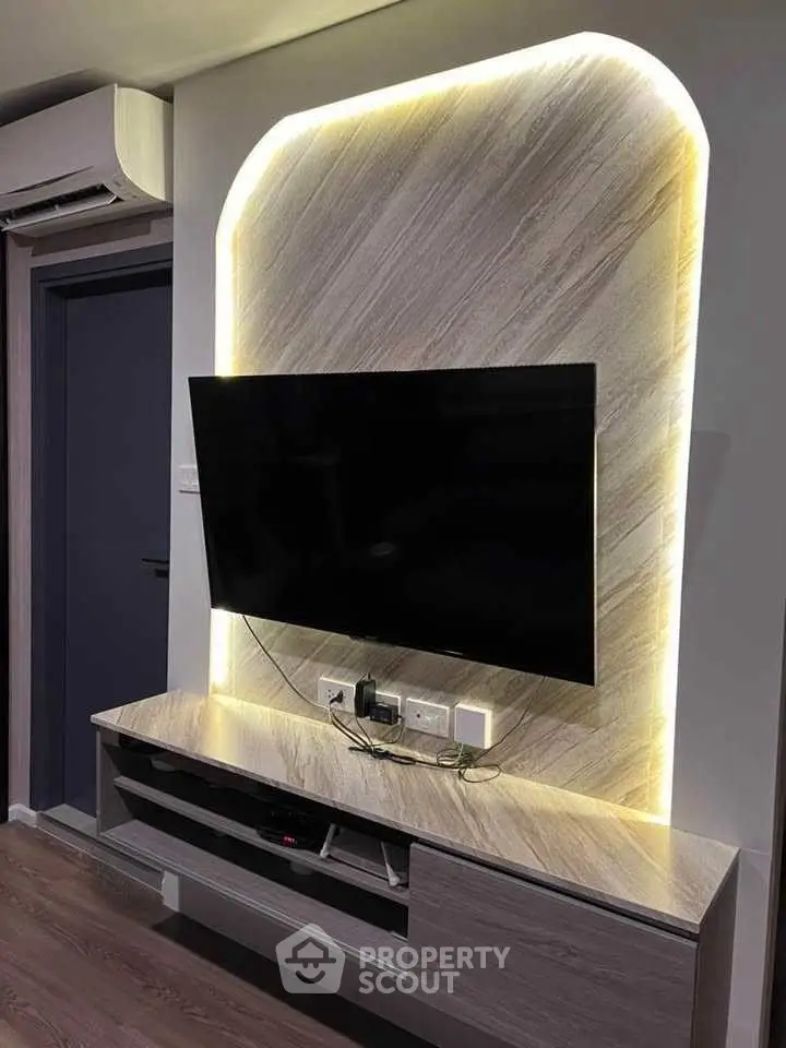 Modern living room with stylish TV setup and ambient lighting