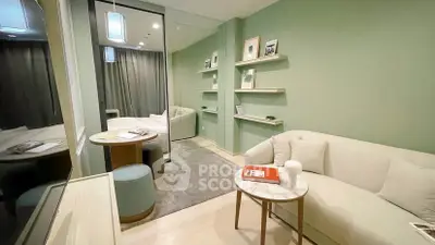 Modern living room with stylish decor and cozy seating area in a contemporary apartment.