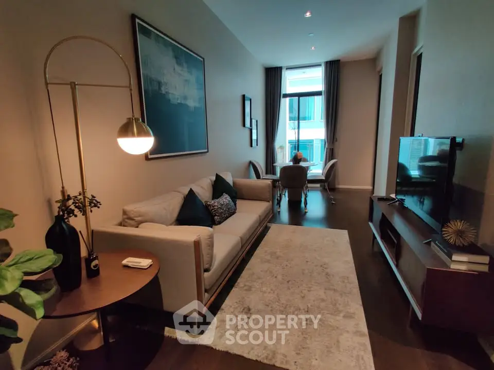 Stylish living room with modern decor and natural light, perfect for relaxation and entertainment.