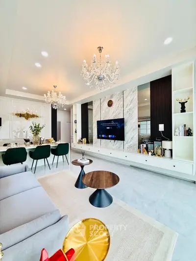 Luxurious modern living room with elegant chandeliers and stylish decor