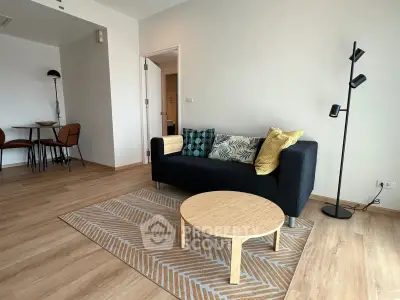 Modern living room with stylish decor and cozy seating area in a contemporary apartment.
