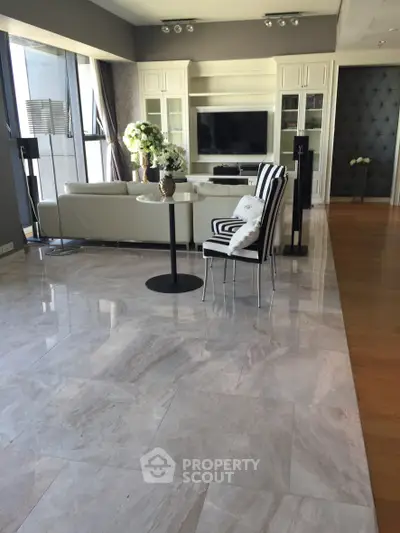 Luxurious living room with marble flooring and elegant decor