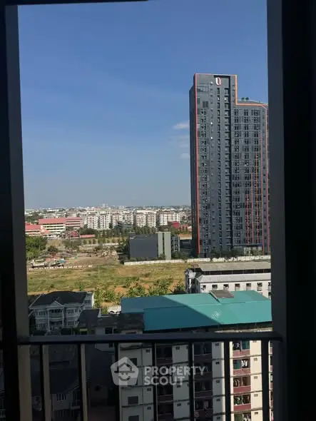 Stunning urban view from high-rise balcony showcasing modern cityscape and skyline.