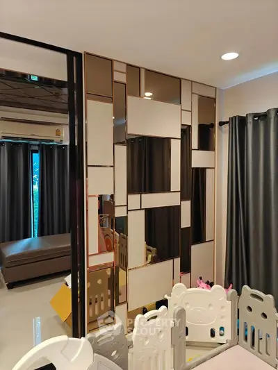 Stylish modern living room with unique wall design and play area
