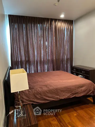 Cozy bedroom with elegant brown curtains and modern furniture