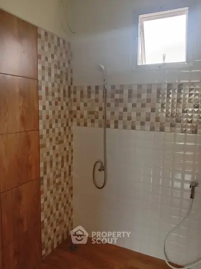 Modern bathroom with stylish tile design and shower area