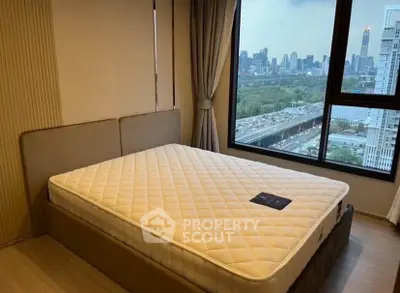 Spacious bedroom with city view in modern apartment