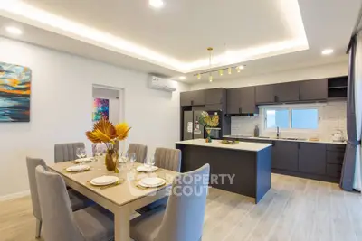 Modern kitchen and dining area with sleek design and elegant decor