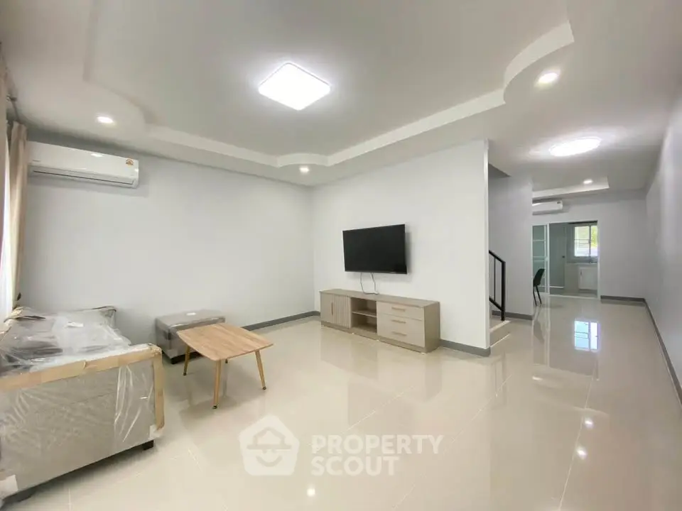 Spacious modern living room with sleek design and natural light