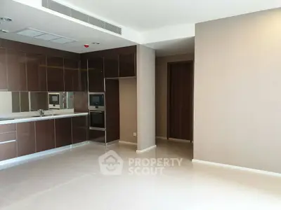 Modern kitchen with sleek cabinetry and built-in appliances in a spacious open layout.