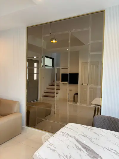 Modern living room with stylish decor and elegant marble table