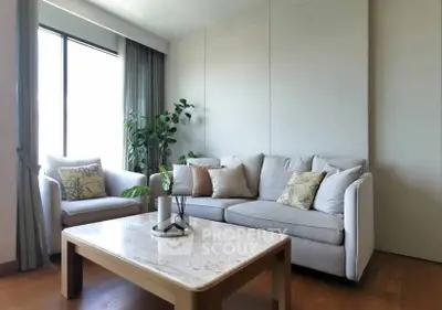 Elegant living room with cozy sofas and natural light