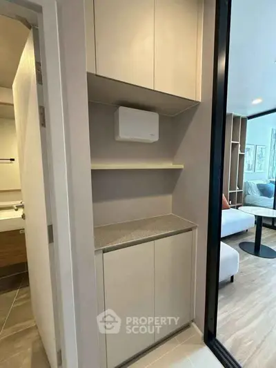 Modern apartment interior with sleek storage and open living area