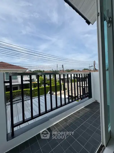 Charming balcony with scenic neighborhood view, perfect for relaxation and enjoying the outdoors.