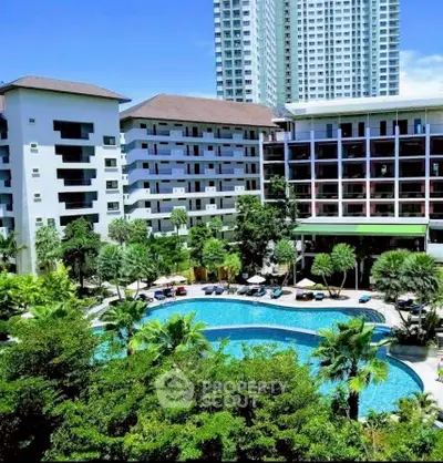 Luxurious residential complex with stunning pool and lush greenery, perfect for modern living.