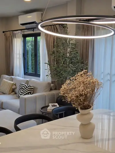 Modern living room with stylish lighting and elegant decor