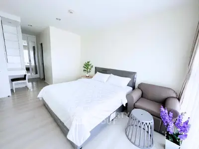 Bright and spacious bedroom with modern decor and natural light