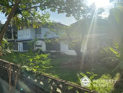 Charming suburban house with lush garden and mature trees, perfect for nature lovers seeking tranquility.