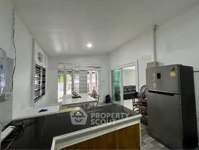 Spacious kitchen with modern appliances and open layout, perfect for family gatherings.