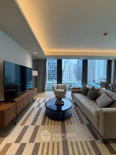 Luxurious modern living room with city view, featuring elegant furniture and large flat-screen TV.